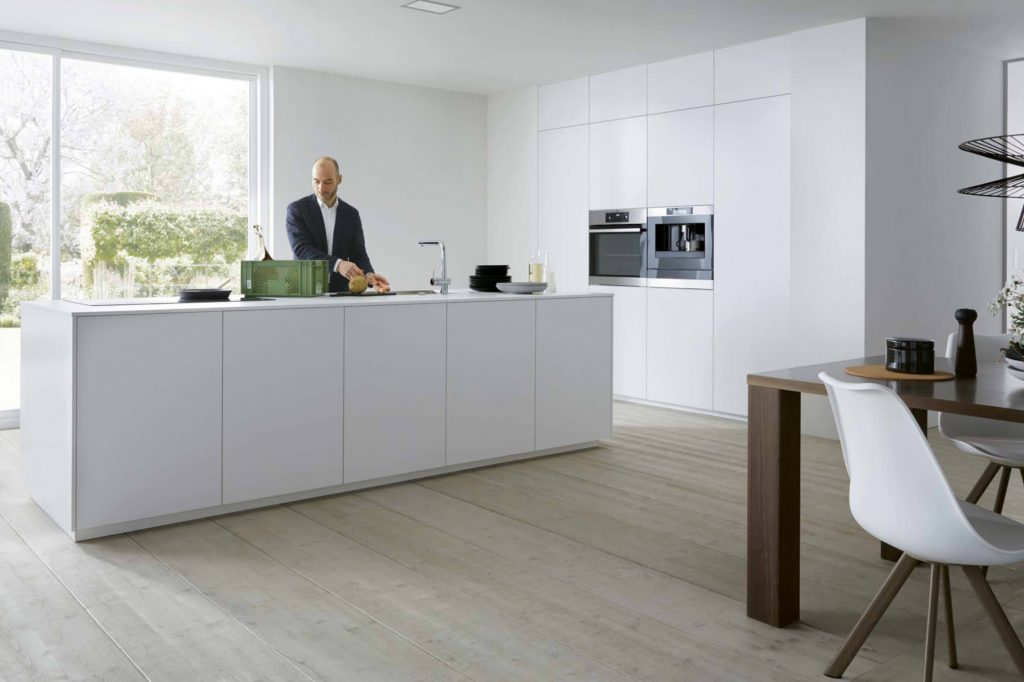 German kitchen with island in Crystal White