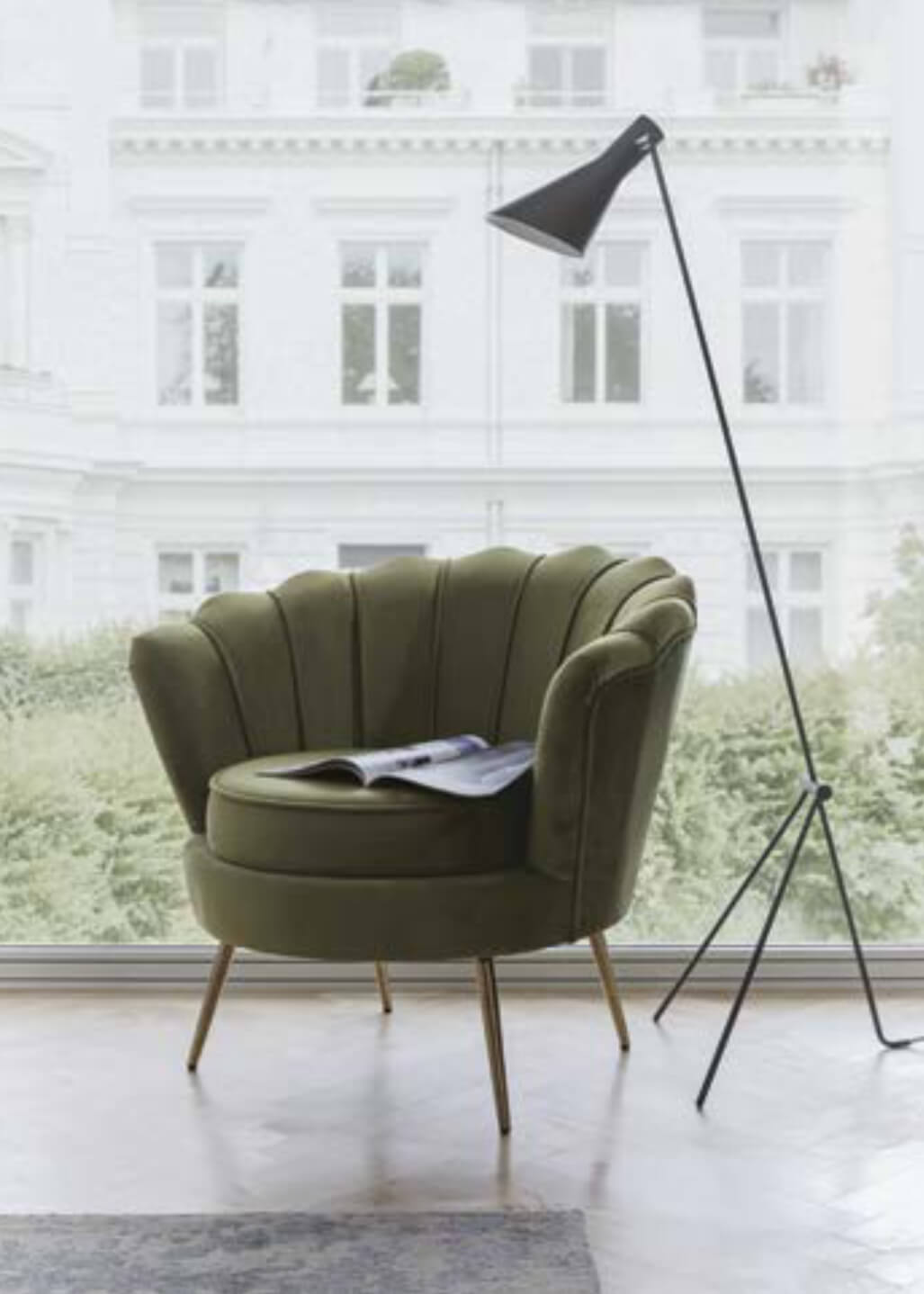Green armchair with lamp