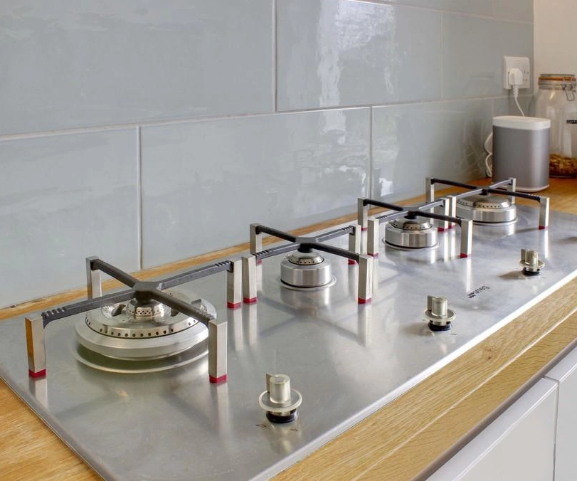 Linear gas hob on wooden worktop